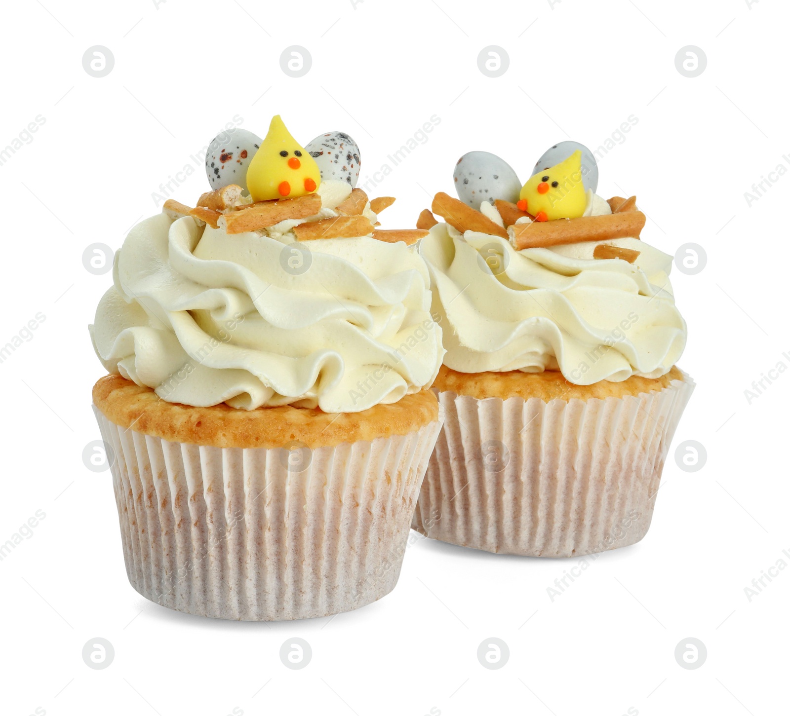 Photo of Tasty Easter cupcakes with vanilla cream isolated on white