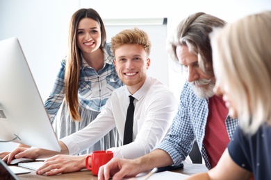 Photo of Business people discussing work matters in office. Professional communication