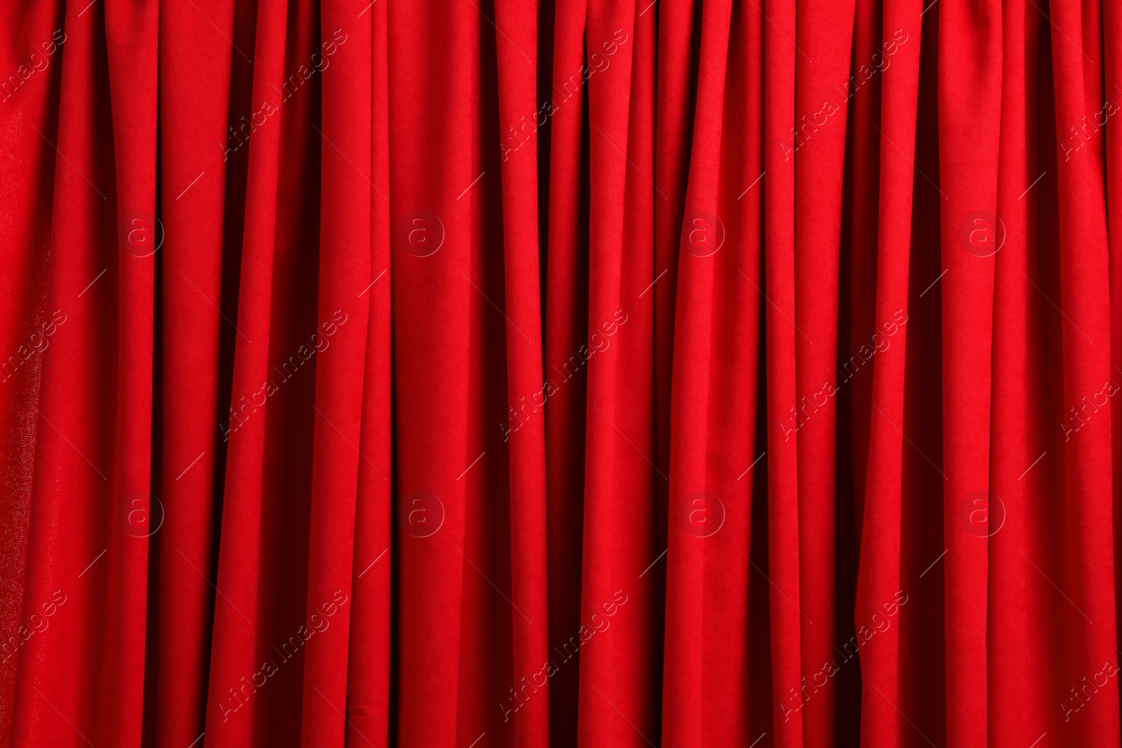 Photo of Closed elegant red front curtains as background, closeup