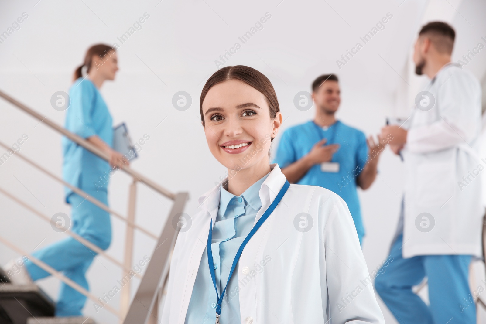 Photo of Portrait of female doctor on staircase in clinic