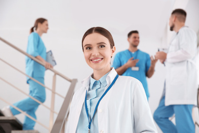 Portrait of female doctor on staircase in clinic