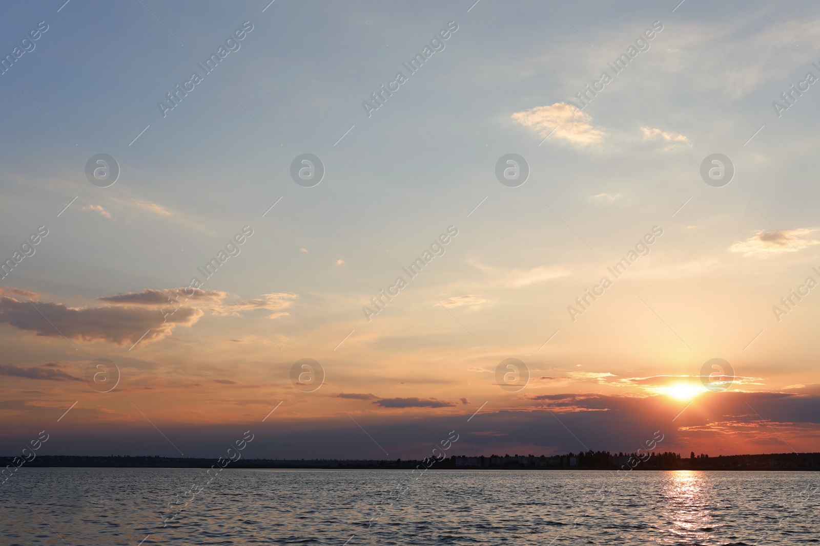 Photo of Picturesque view of beautiful sunrise on riverside. Morning sky