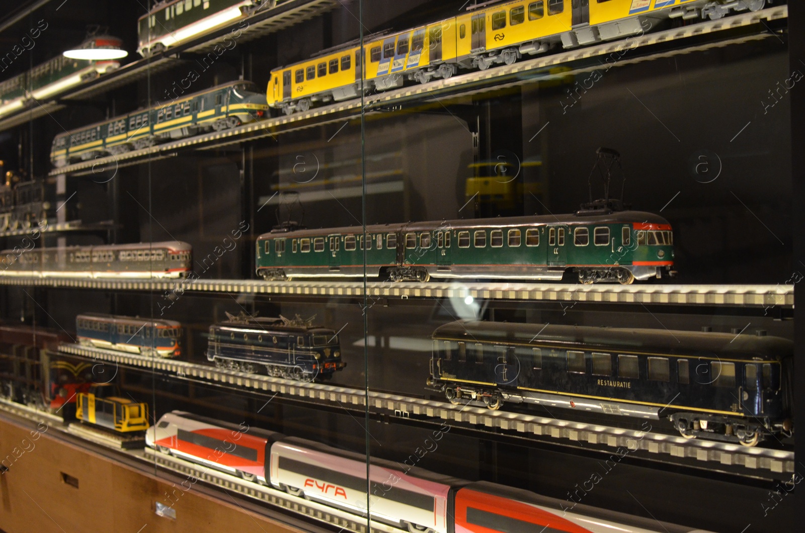 Photo of Utrecht, Netherlands - July 23, 2022: Models of different old trains on display in Spoorwegmuseum