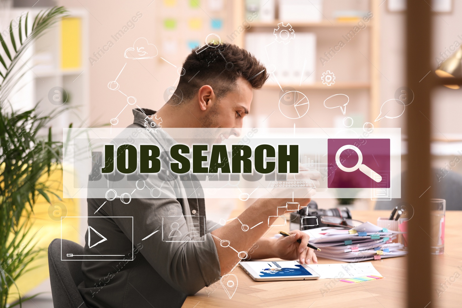 Image of Man with tablet and coffee at table in office. Job search