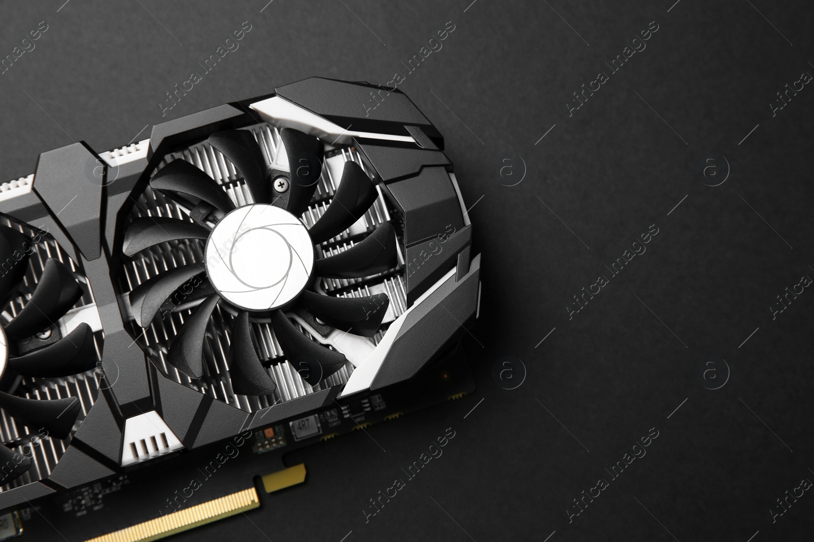 Photo of Computer graphics card on black background, top view. Space for text