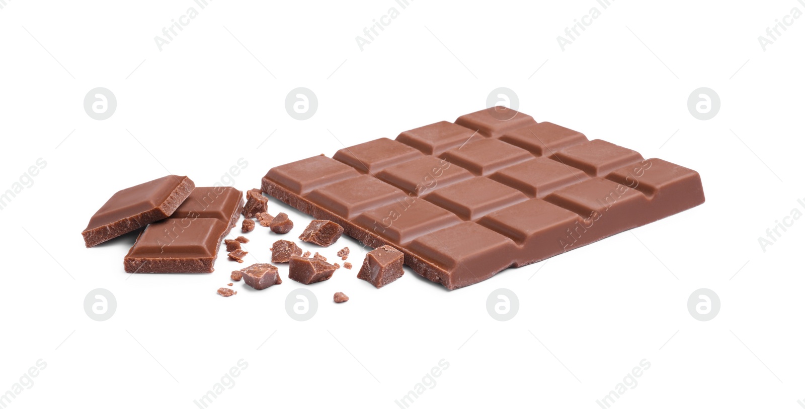 Photo of Pieces of delicious milk chocolate bar on white background