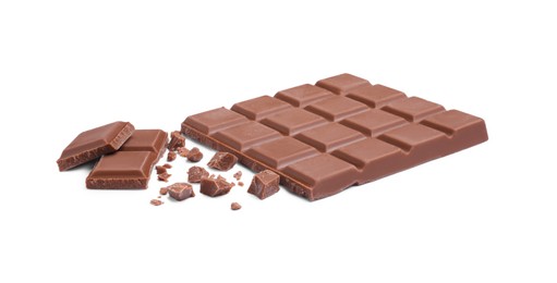 Pieces of delicious milk chocolate bar on white background