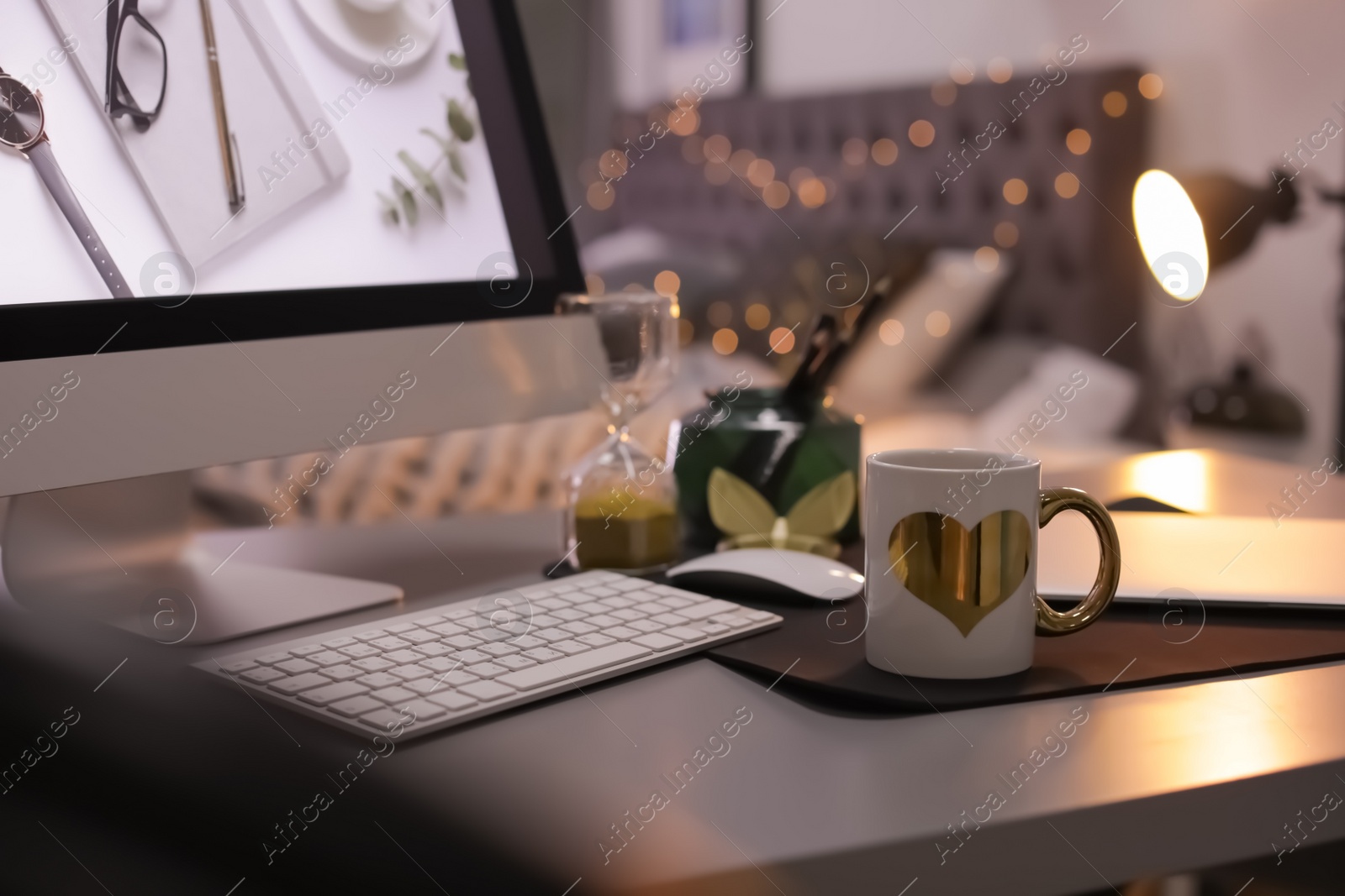 Photo of Stylish workplace interior with modern computer on desk