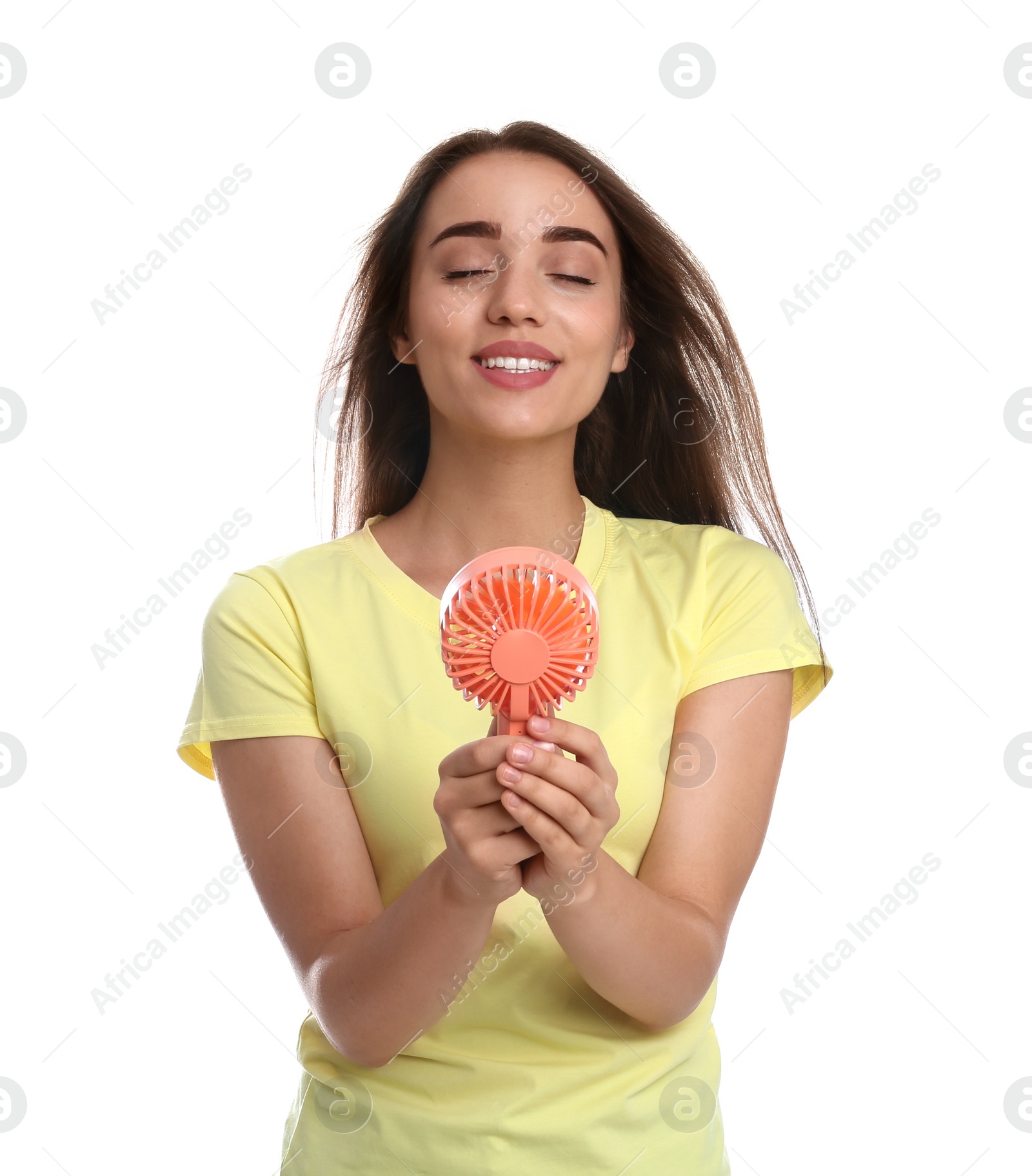 Photo of Woman enjoying air flow from portable fan on white background. Summer heat