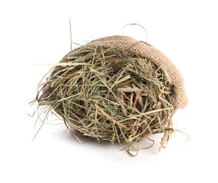 Dried hay in burlap sack isolated on white