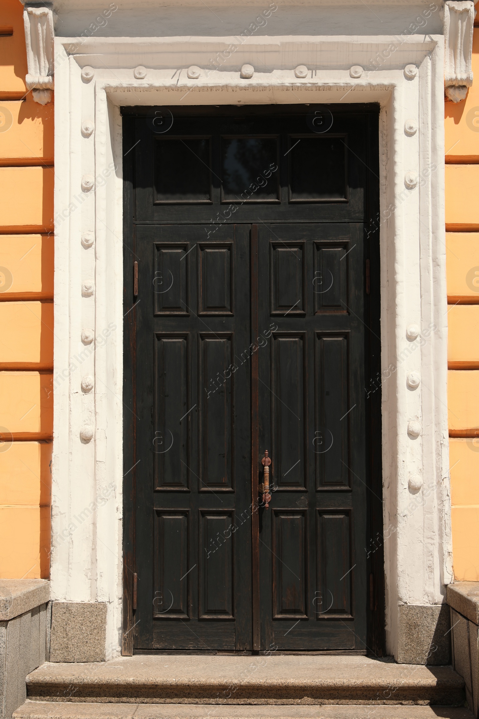 Photo of Building with vintage wooden door. Exterior design