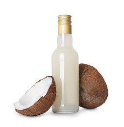 Bottle of delicious syrup for coffee and coconut isolated on white
