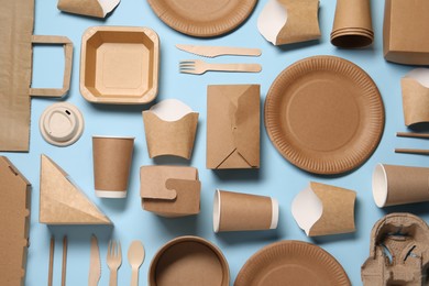 Photo of Flat lay composition with eco friendly food packagings on light blue background