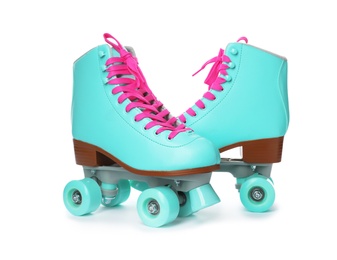 Photo of Pair of bright stylish roller skates on white background