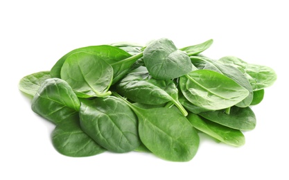 Pile of fresh green healthy baby spinach leaves on white background