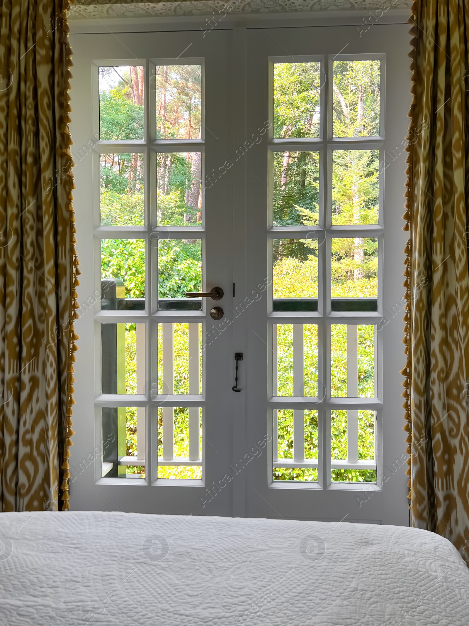 Photo of Window with beautiful view on garden in cozy room. Interior design