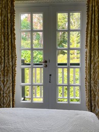 Photo of Window with beautiful view on garden in cozy room. Interior design