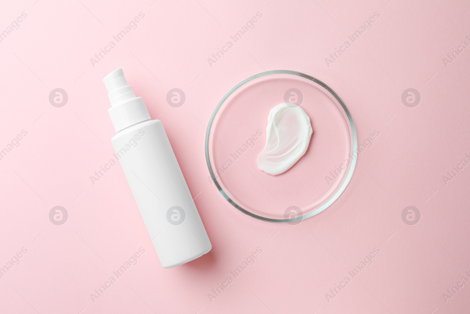 Photo of Petri dish and cosmetic product on pink background, flat lay