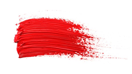 Photo of Red oil paint stroke on white background, top view