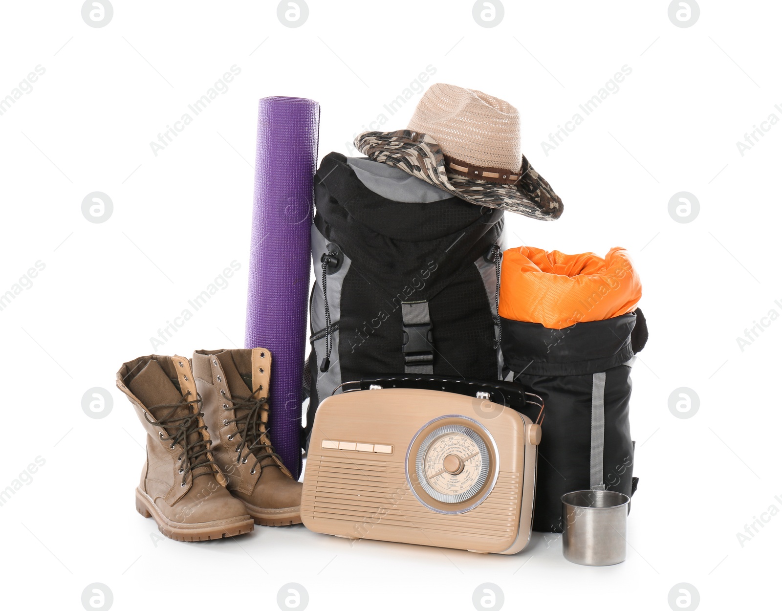 Photo of Set of camping equipment with sleeping bag on white background