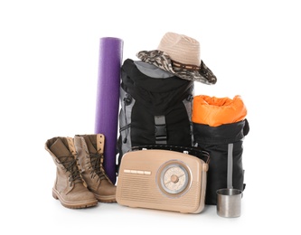 Photo of Set of camping equipment with sleeping bag on white background