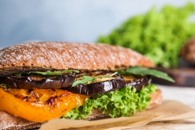 Photo of Delicious fresh sandwich with eggplant, closeup view