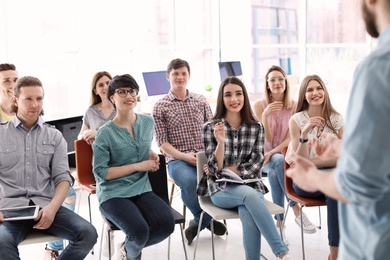 Photo of Young people having business training in office