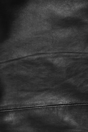 Photo of Texture of black leather as background, top view