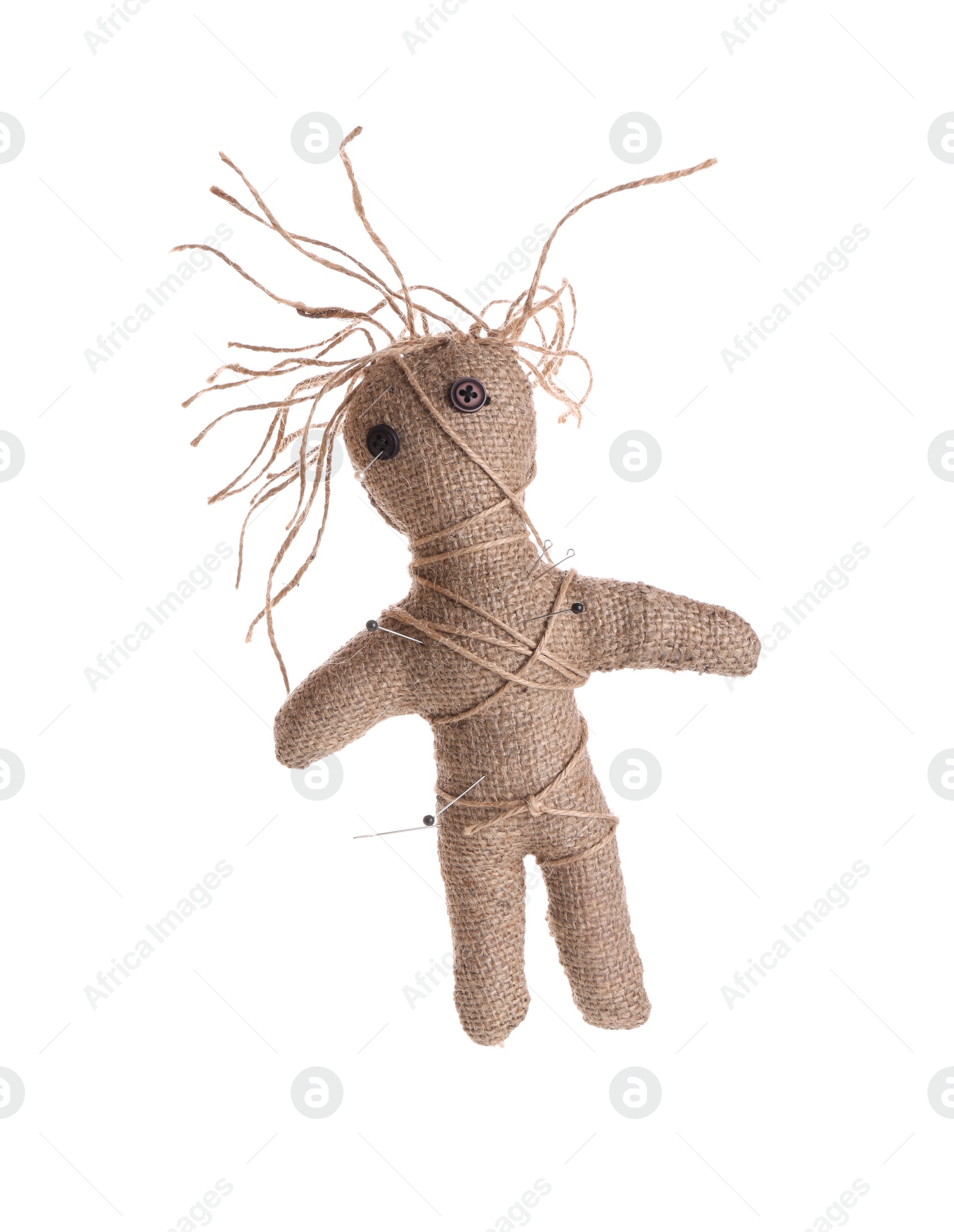 Photo of Woman stabbing voodoo doll with pin on white background, closeup. Curse ceremony