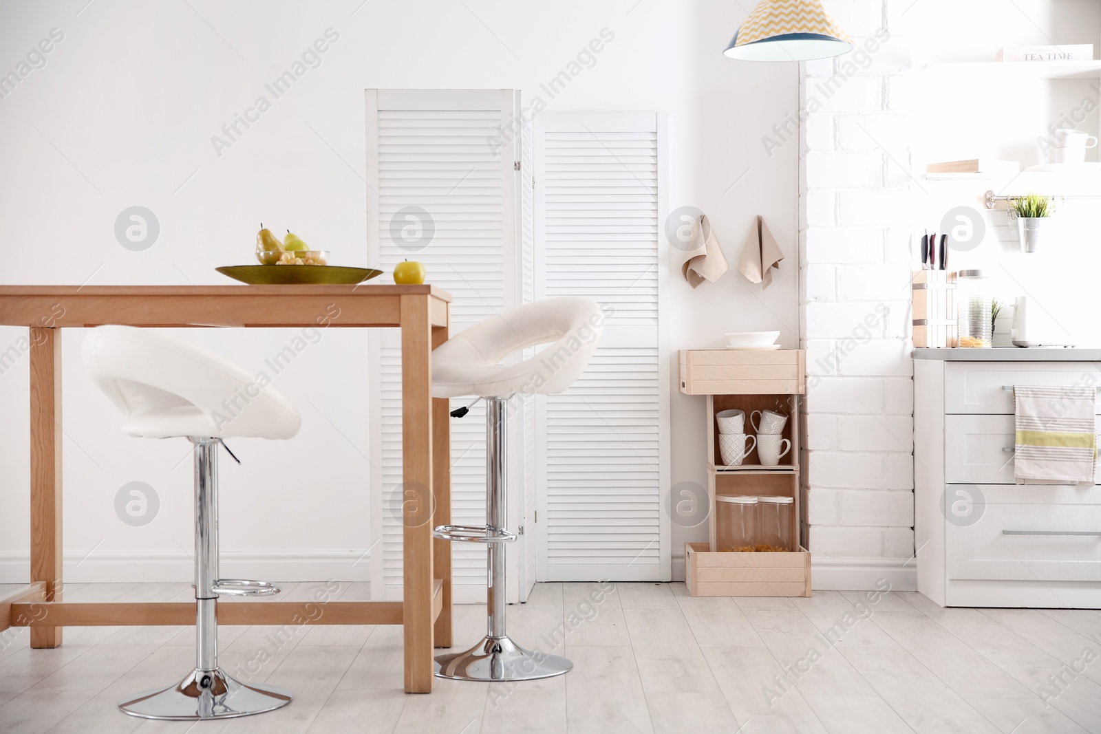 Photo of Modern eco style kitchen interior with wooden crates and table