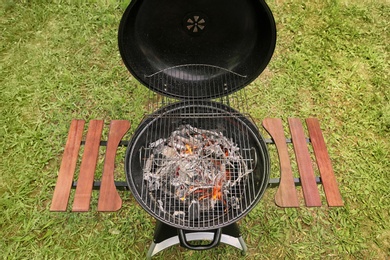 Photo of New modern barbecue grill outdoors. Summer picnic