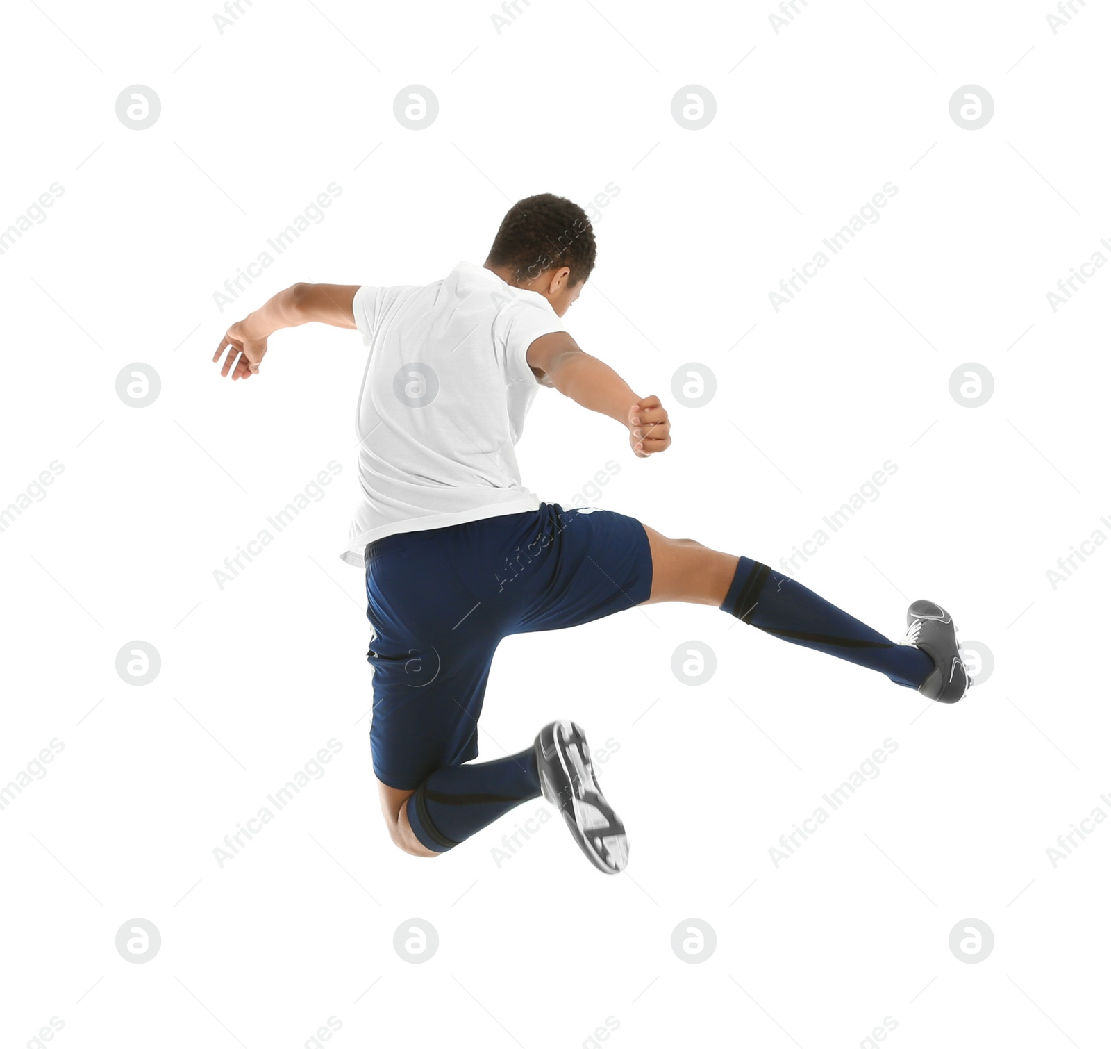 Photo of Teenage African-American boy playing football on white background