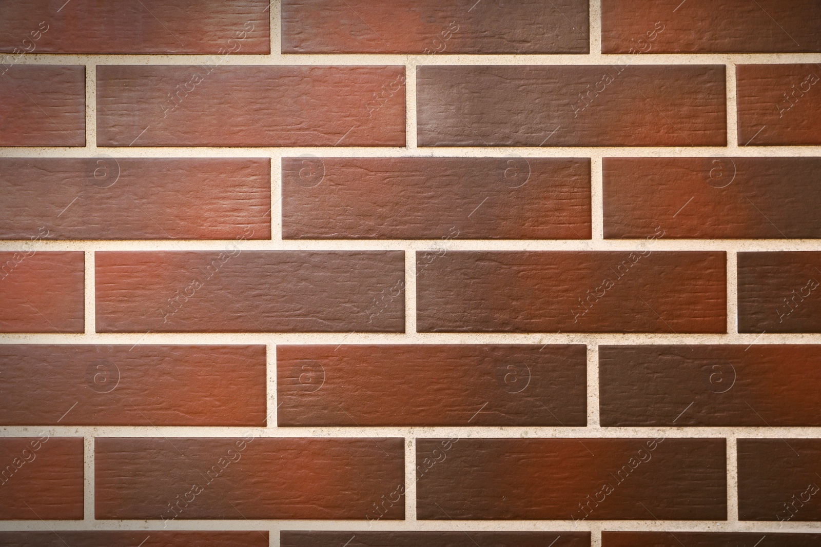 Photo of Texture of brown brick wall as background