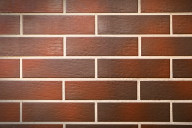 Photo of Texture of brown brick wall as background