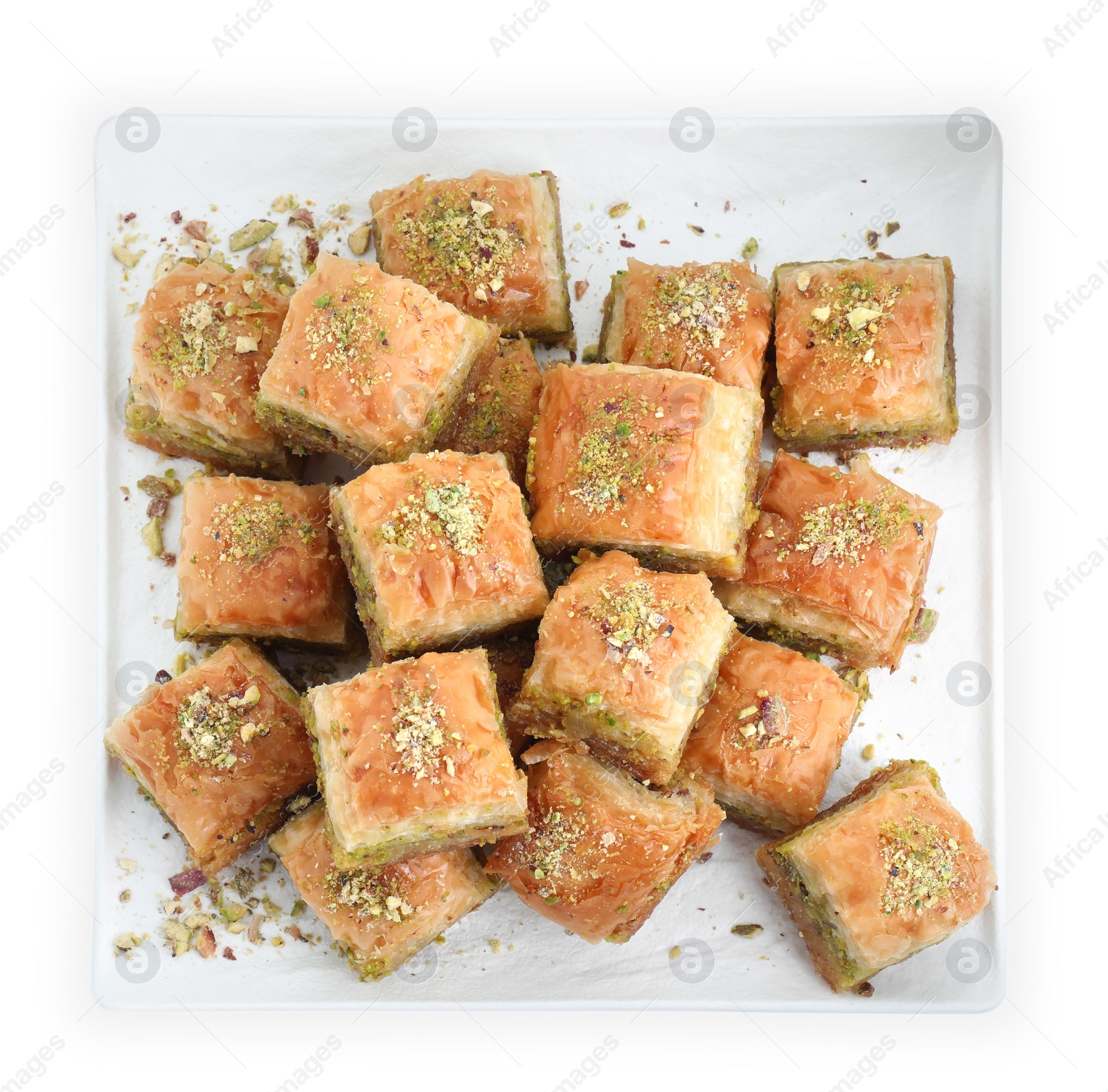 Photo of Delicious fresh baklava with chopped nuts isolated on white, top view. Eastern sweets