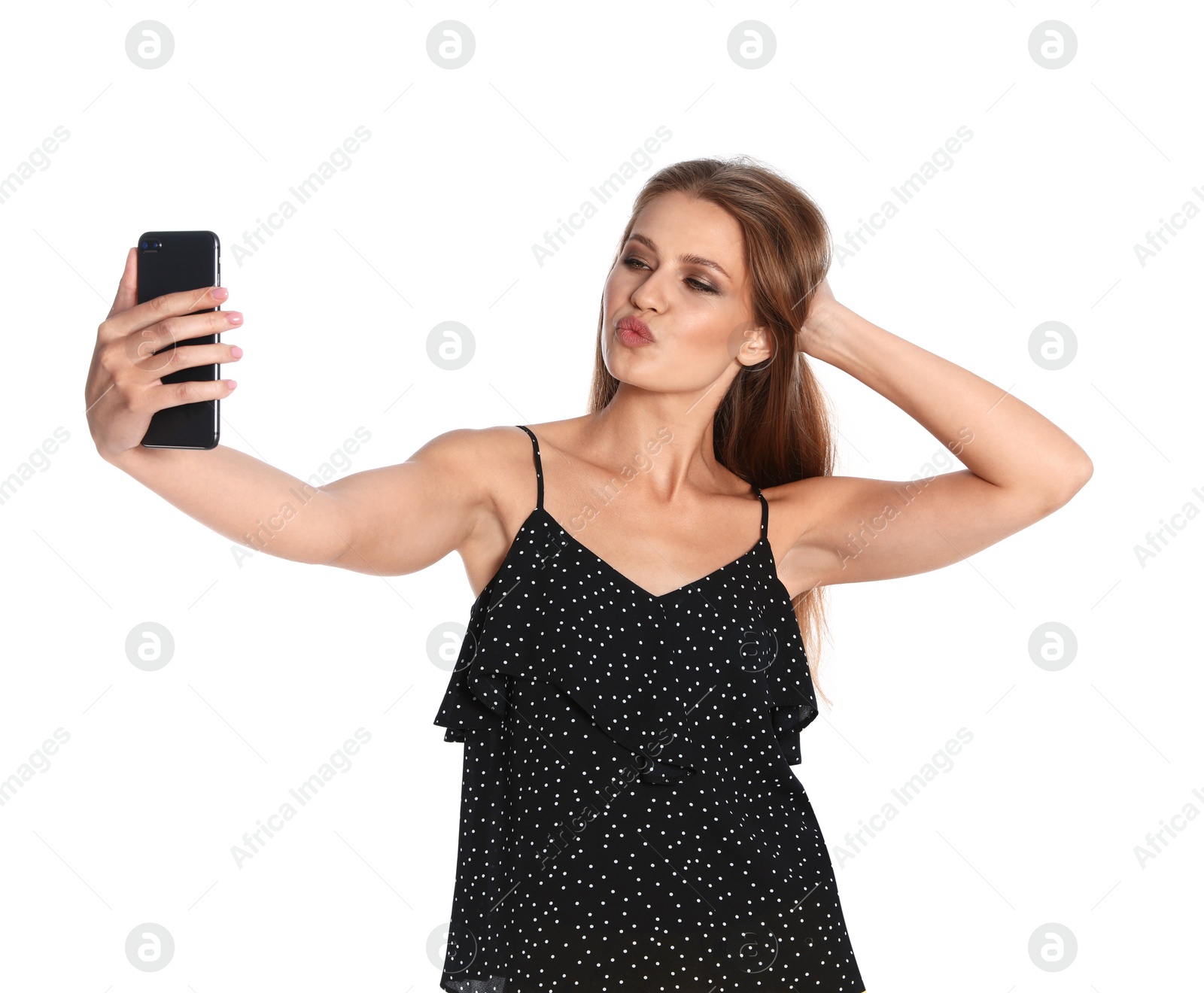 Photo of Flirty young woman taking selfie on white background