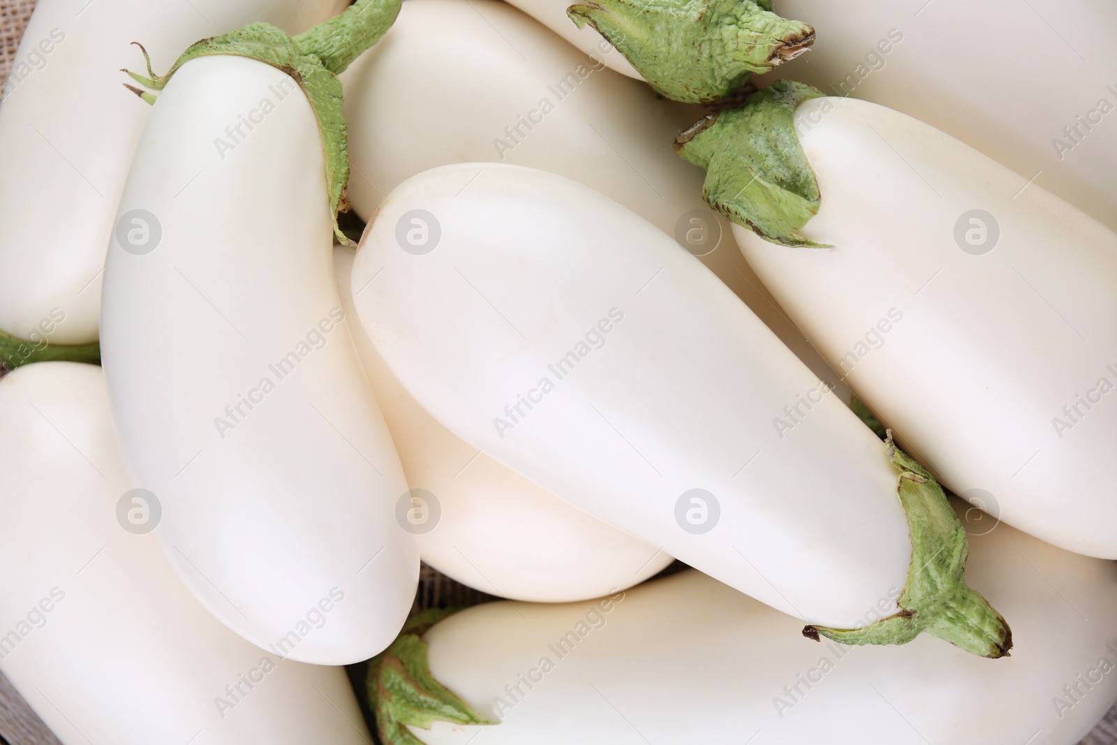 Photo of Fresh white eggplants as background, top view