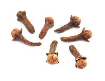 Photo of Aromatic organic dry cloves on white background