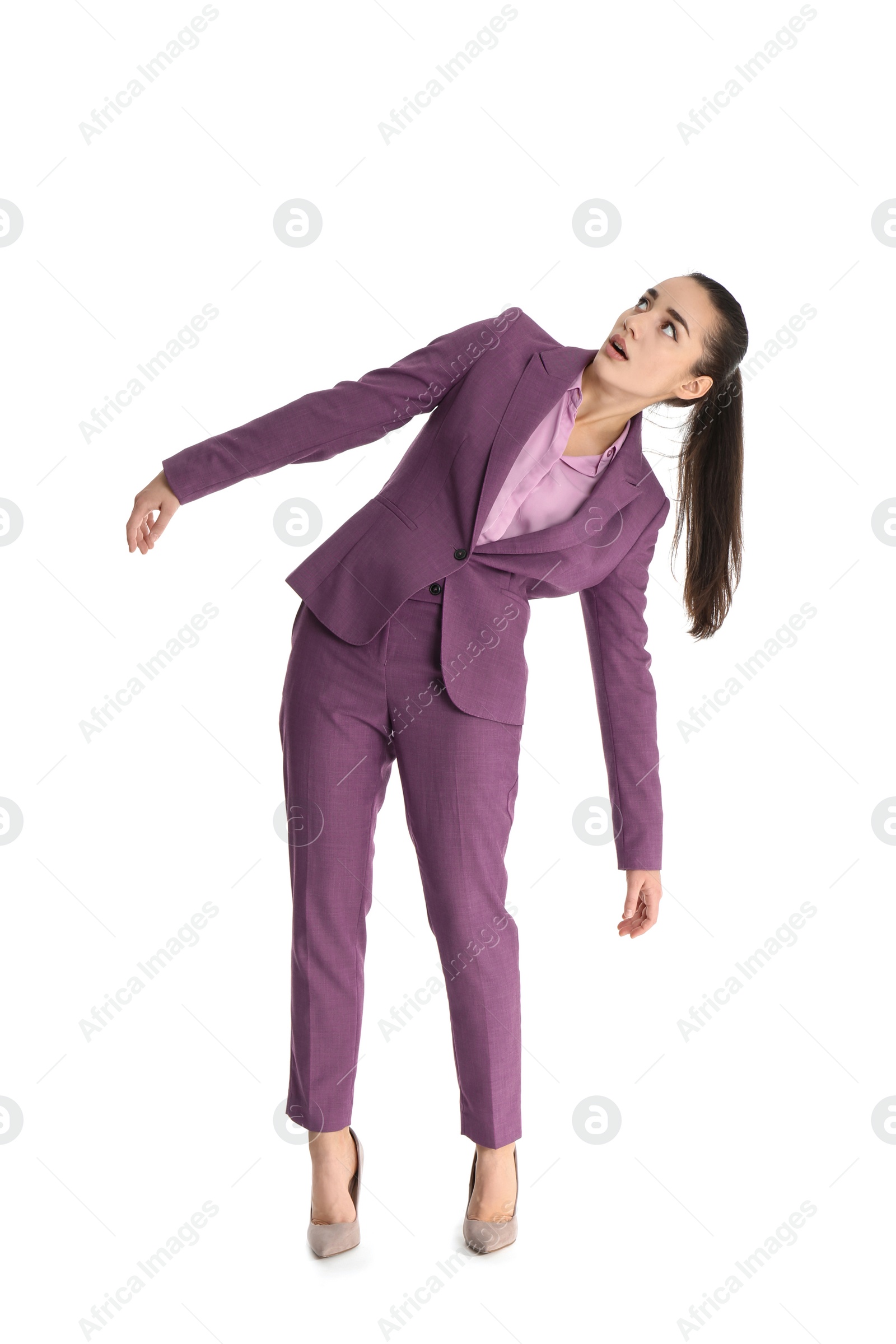 Photo of Businesswoman attracted to magnet on white background