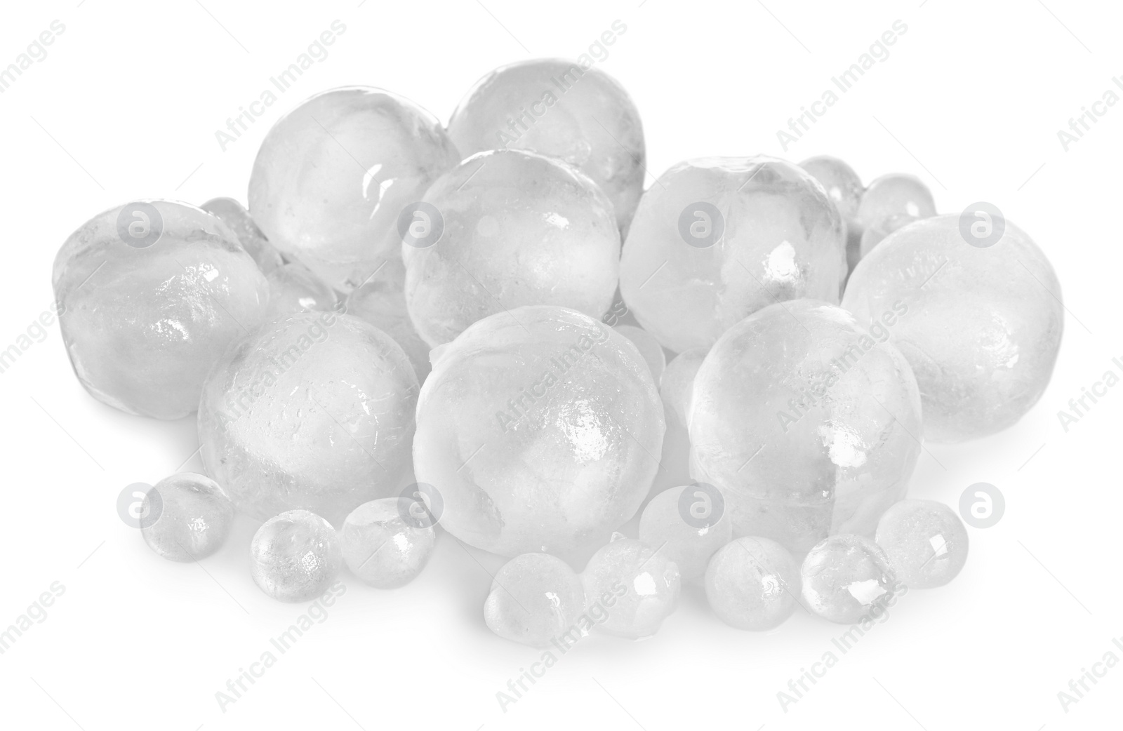 Photo of Many frozen ice balls on white background