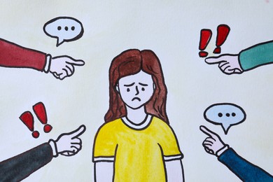 Photo of Drawing of people bullying sad woman, closeup