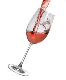 Image of Pouring delicious rose wine into glass on white background