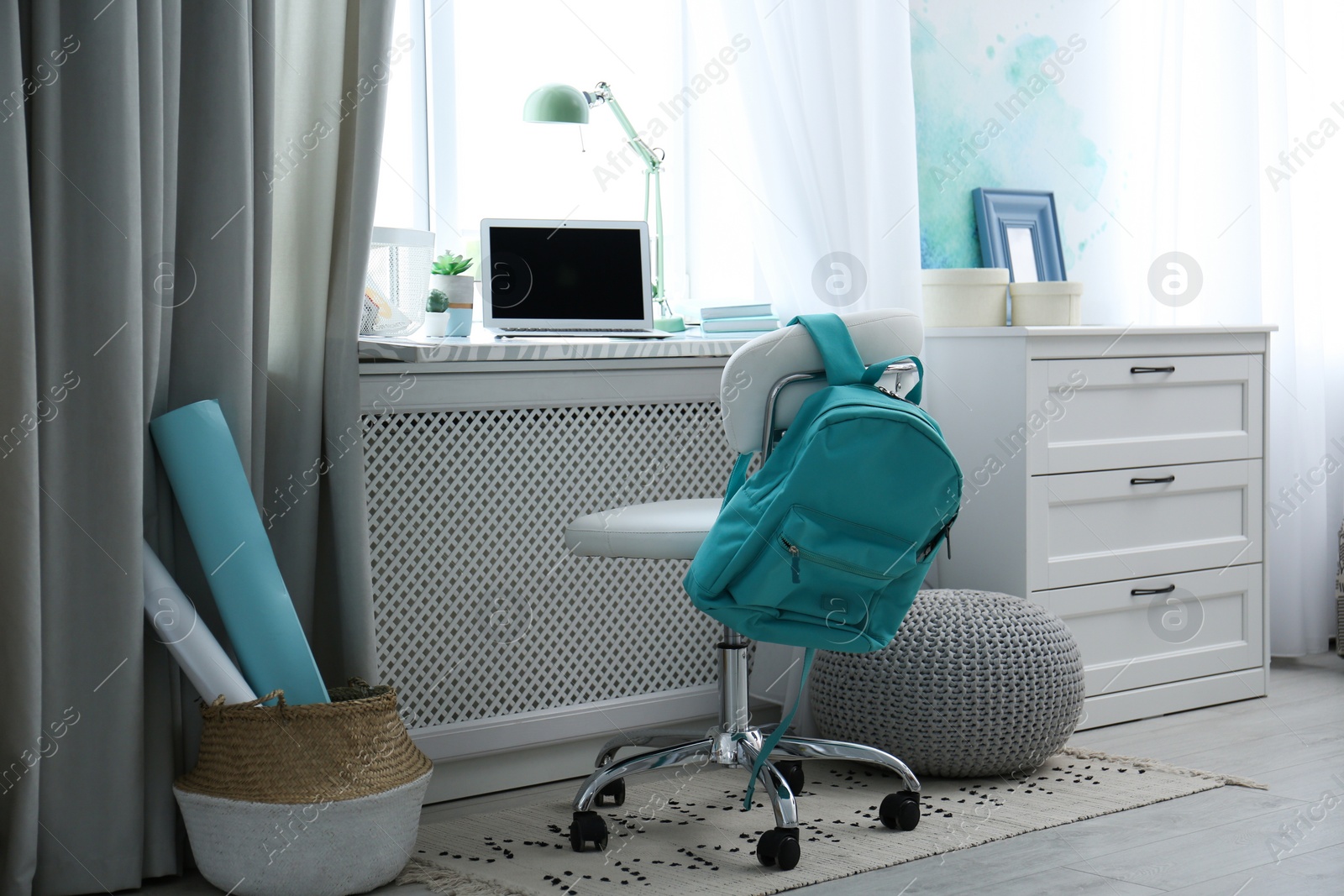 Photo of Comfortable workplace with laptop on window sill at home