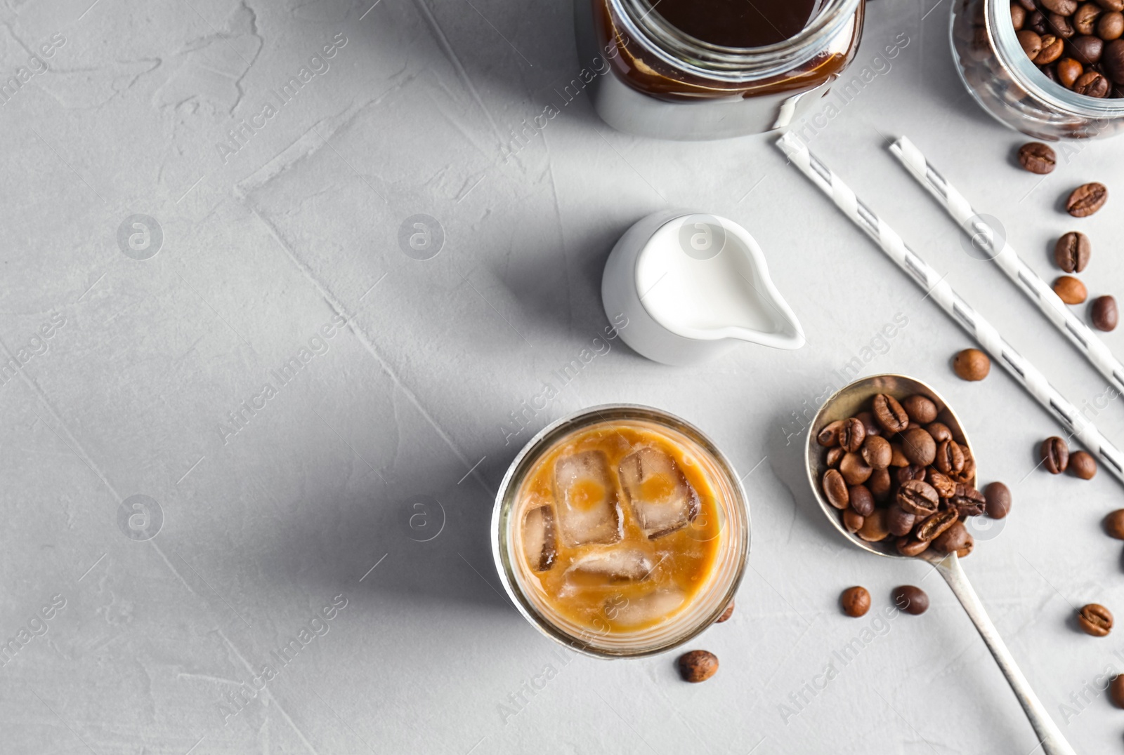 Photo of Flat lay composition with cold brew coffee and milk on grey background