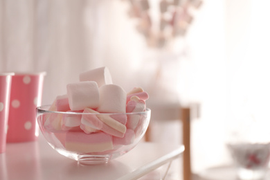 Photo of Tasty marshmallow for birthday party on white table, closeup