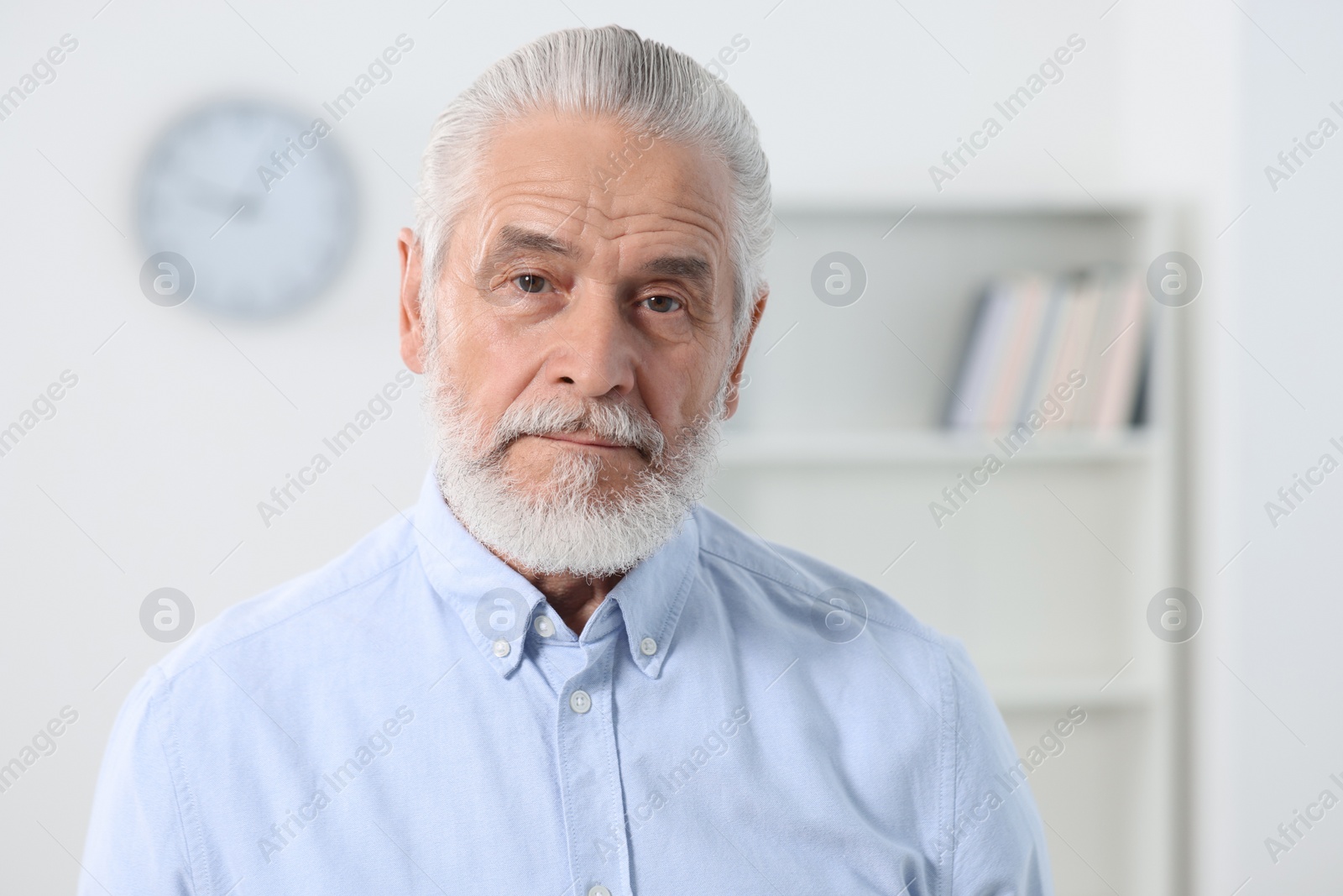 Photo of Portrait of handsome senior man in office. Space for text