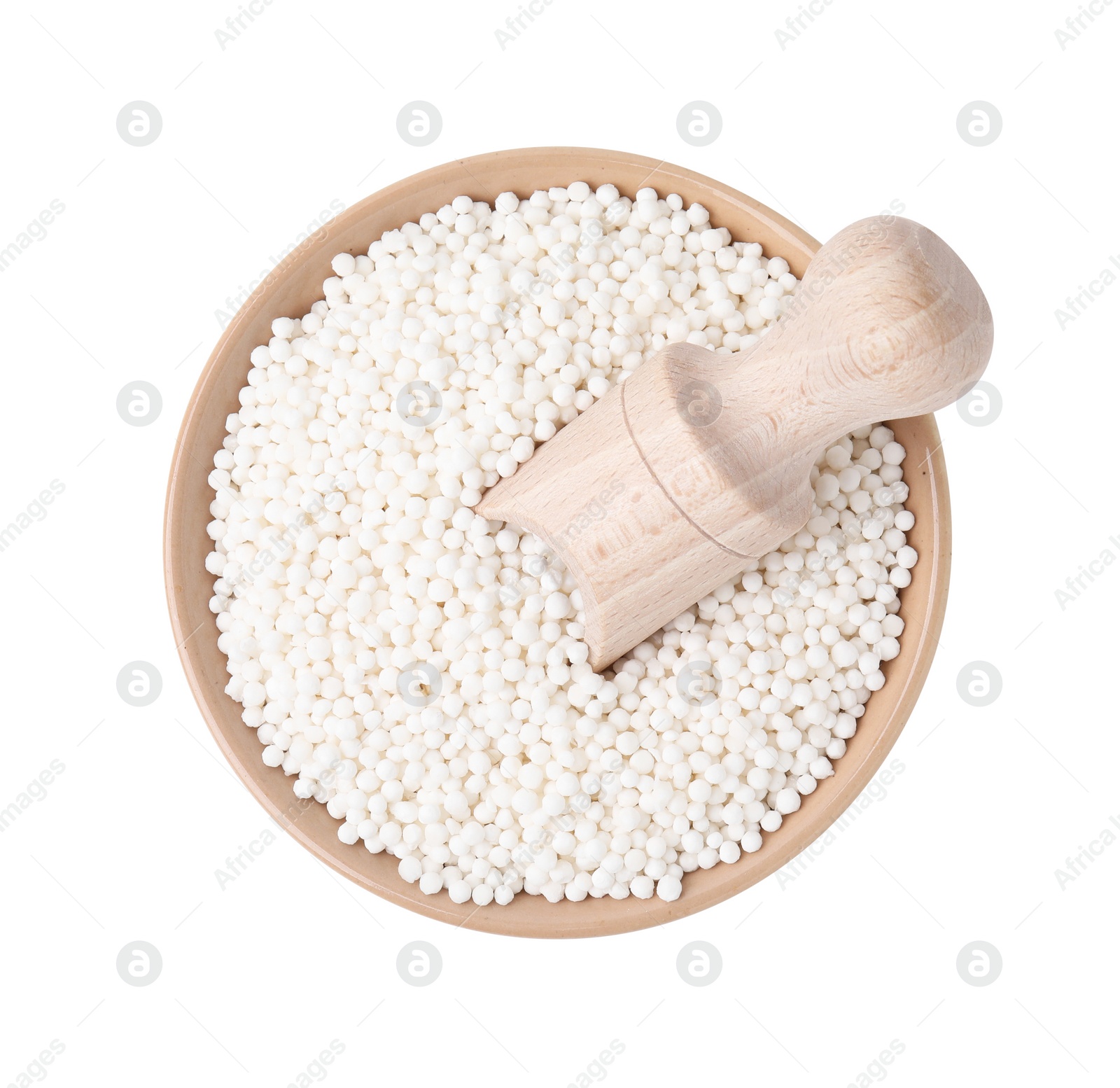 Photo of Tapioca pearls and scoop in bowl isolated on white, top view