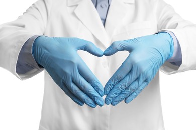 Doctor wearing light blue medical gloves making heart gesture on white background, closeup