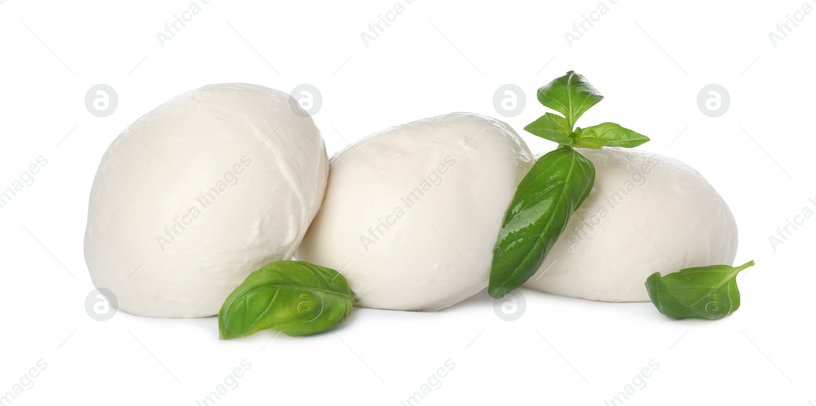 Photo of Delicious mozzarella cheese balls and basil on white background