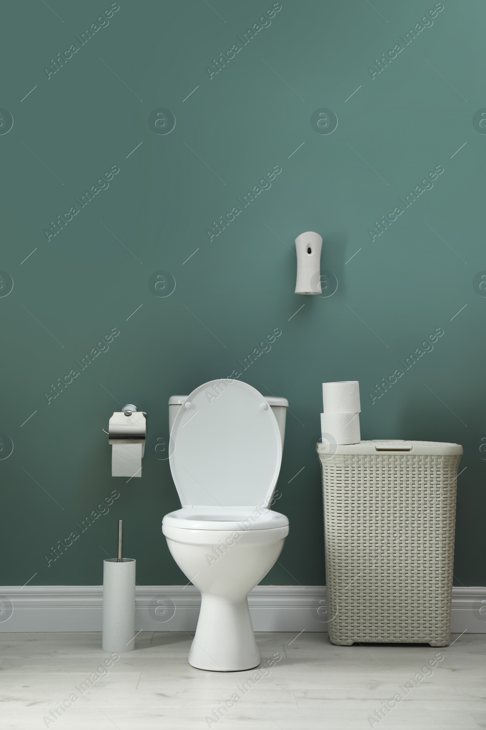 Photo of Bathroom with automatic air freshener on wall